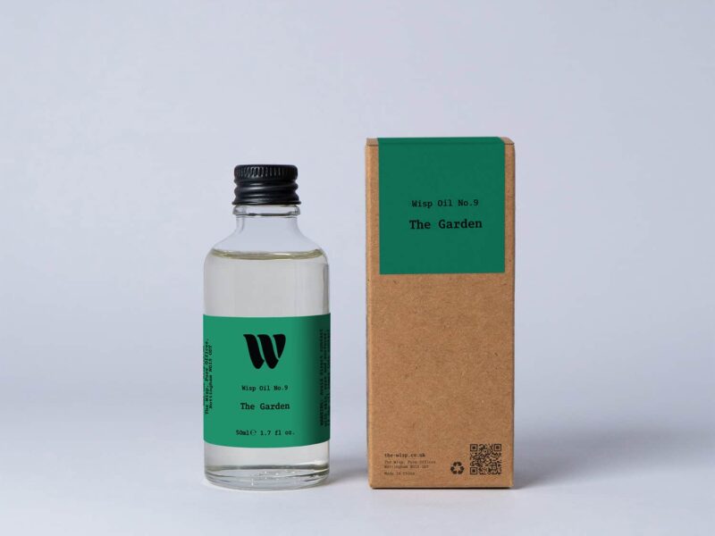 Bottle of the 50ml Wisp home fragrance oil No.9 The Garden which has notes of lotus blossom and water lily.
